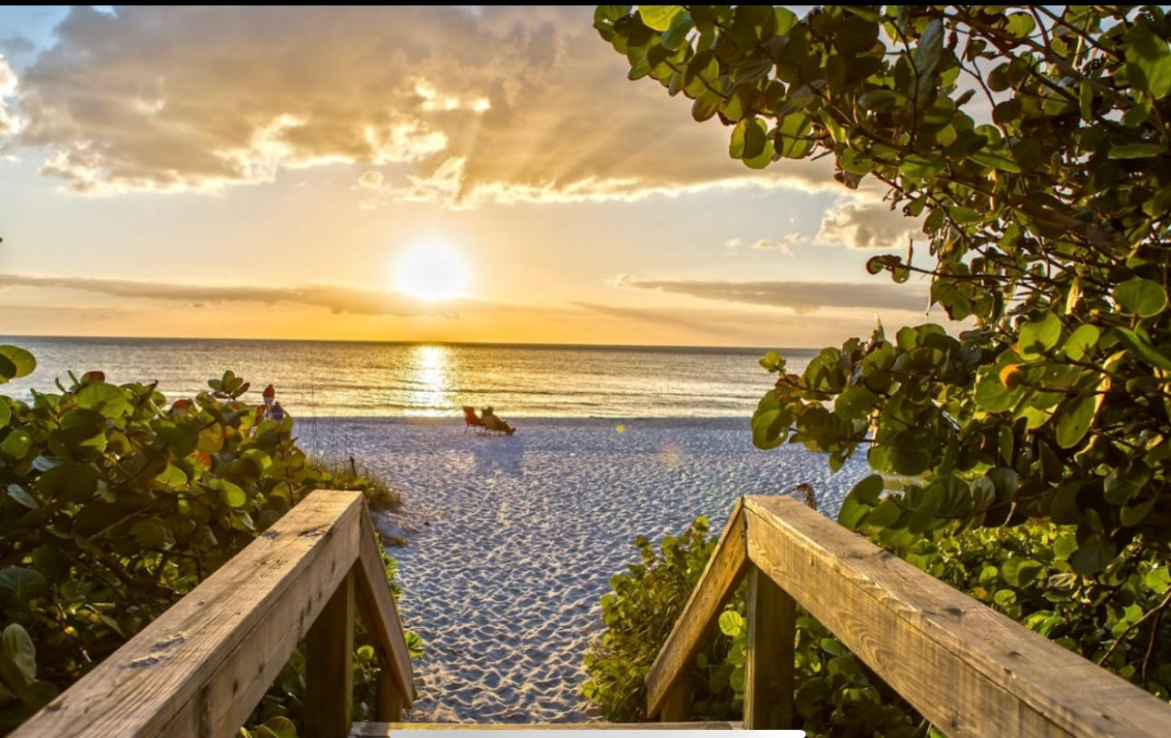 Beach access at golden hour in Naples
